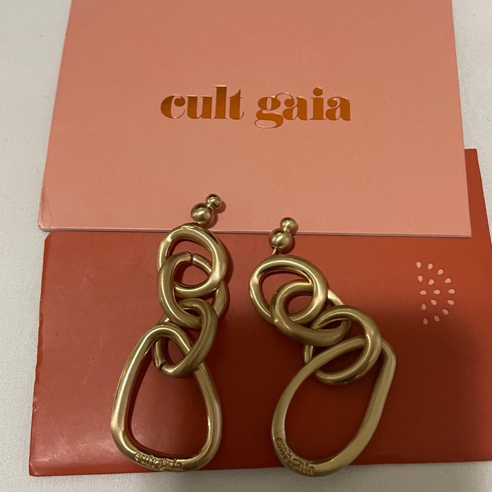cult gaia Gold Tone Link Drop Earrings on Orange Pouch